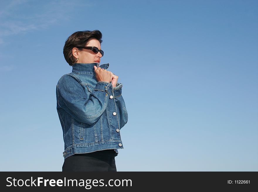 Woman hiding in her wind-breaker of Jean. Woman hiding in her wind-breaker of Jean