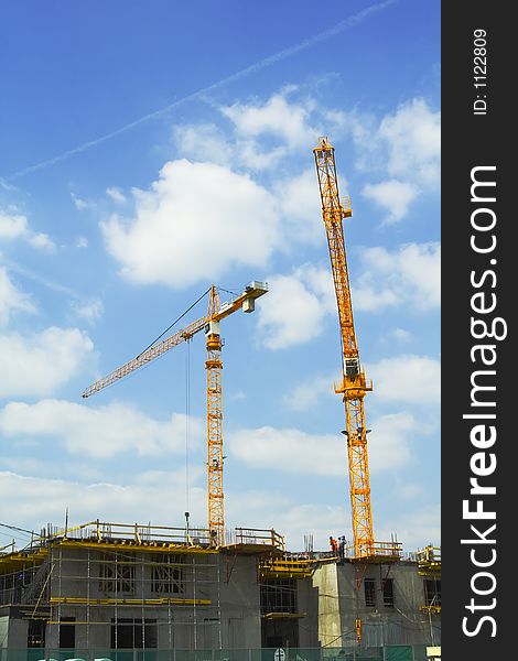 Crane tower on a background of the blue sky