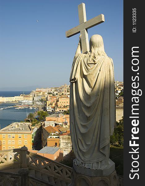 View of Gaeta (southern Italy) from mount Orlando showing medieval city, and the harbour, Juesu holds passion cross in foreground