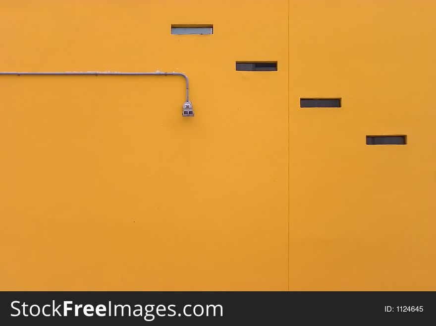 An abstract-looking flat orange wall in winter.