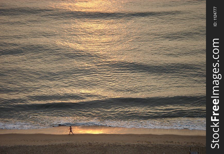 Early morning jog on the beach. Early morning jog on the beach