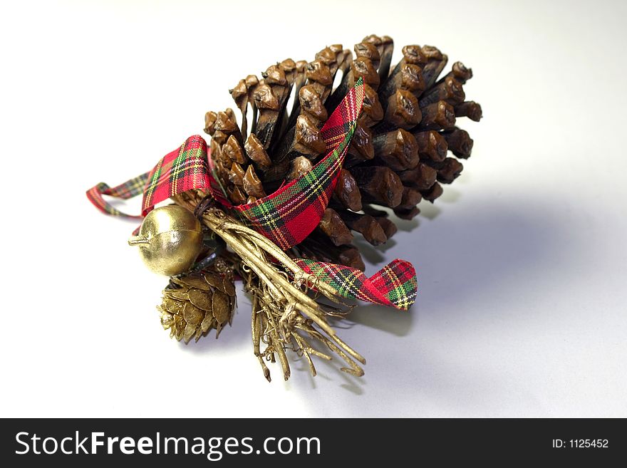 Christmas cone bauble decorated with ribbon and gold objects