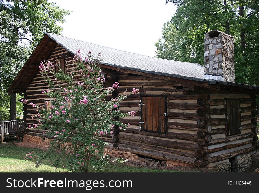 Old rustic log cabin in woods