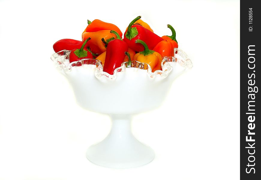 Assorted sweet peppers in a white display dish