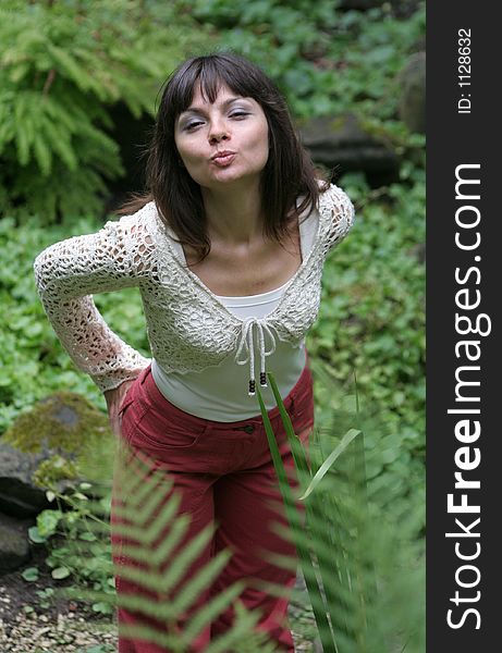 Pretty young woman sending kisses to photographer. Pretty young woman sending kisses to photographer