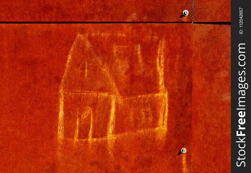 Abstract of rusty plate with child`s hand drawn chalk picture of house. aged steel plate. stain marks. primitive art, background image. modern building materials. . Abstract of rusty plate with child`s hand drawn chalk picture of house. aged steel plate. stain marks. primitive art, background image. modern building materials.