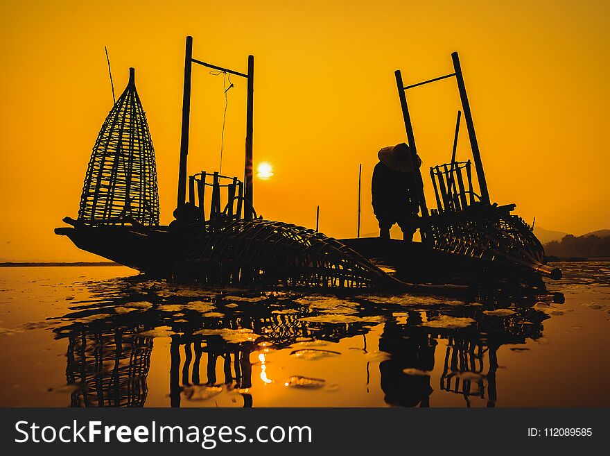 Fishermen fishing in the early morning golden light,fisherman fishing in the river,Thailand,Vietnam,myanmar,Laos