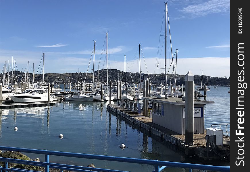 Yacht And Sail Boats Near Boardwalk