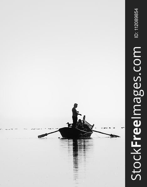 Grayscale Picture of Two People Go on Fishing