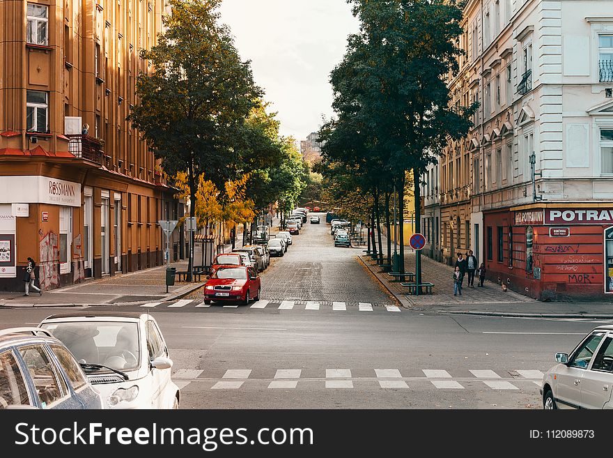 Photo Of Roadway Cross Between Buildings