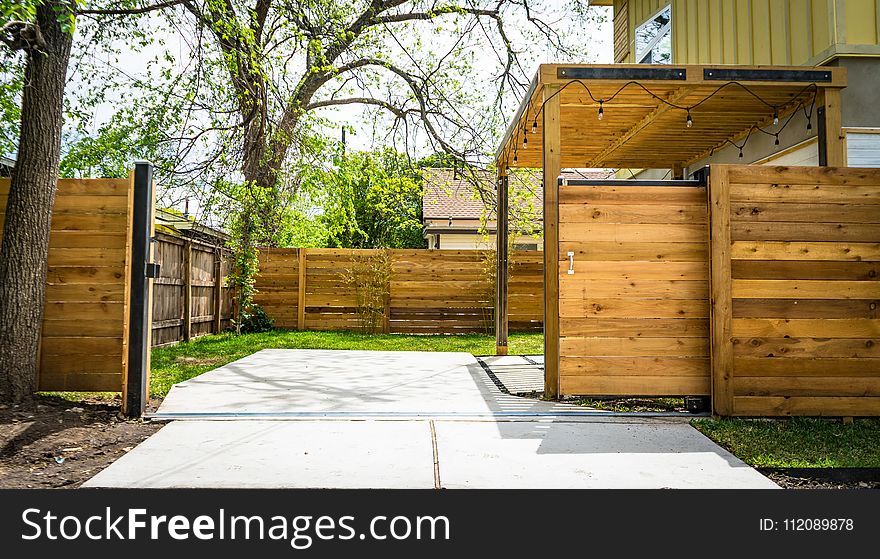 Photo Of Opened Brown Wooden Sliding House Gate