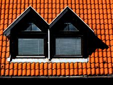 Double Dormers With Brown Clay Pitched Roof Stock Images