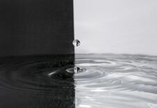 Water Drop On A Black And White Background Royalty Free Stock Photo