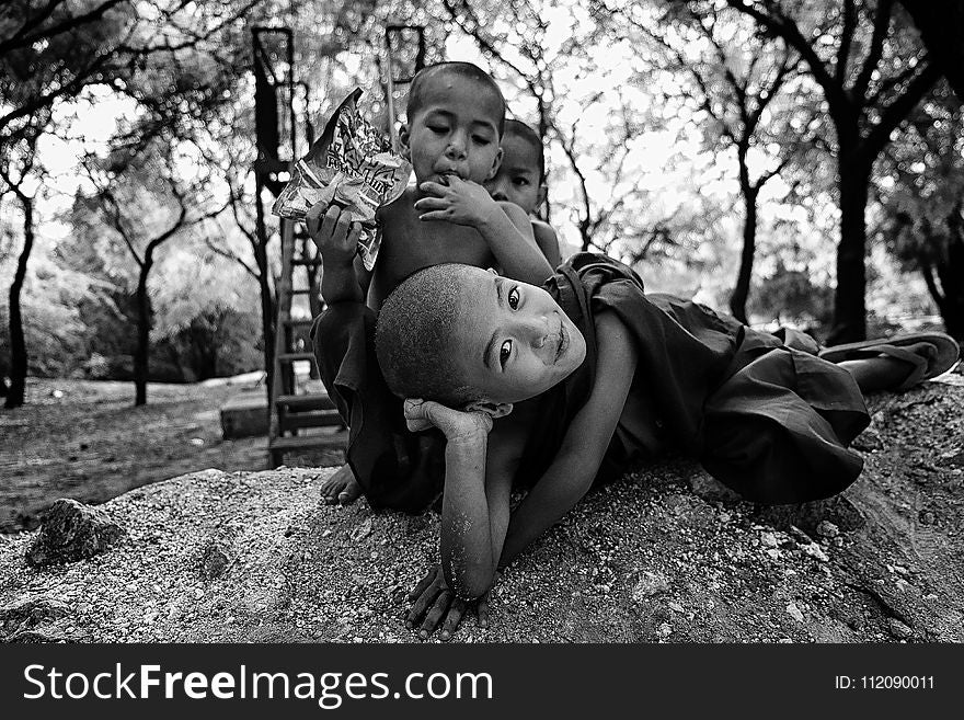 Grayscale Photo Of Three Children Near Trees