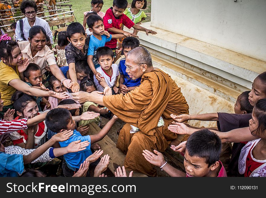 Monk Surrounded By Children