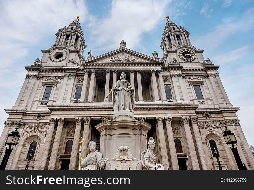 Saint Paul Cathedral and statue of Queen Anne in London, UK