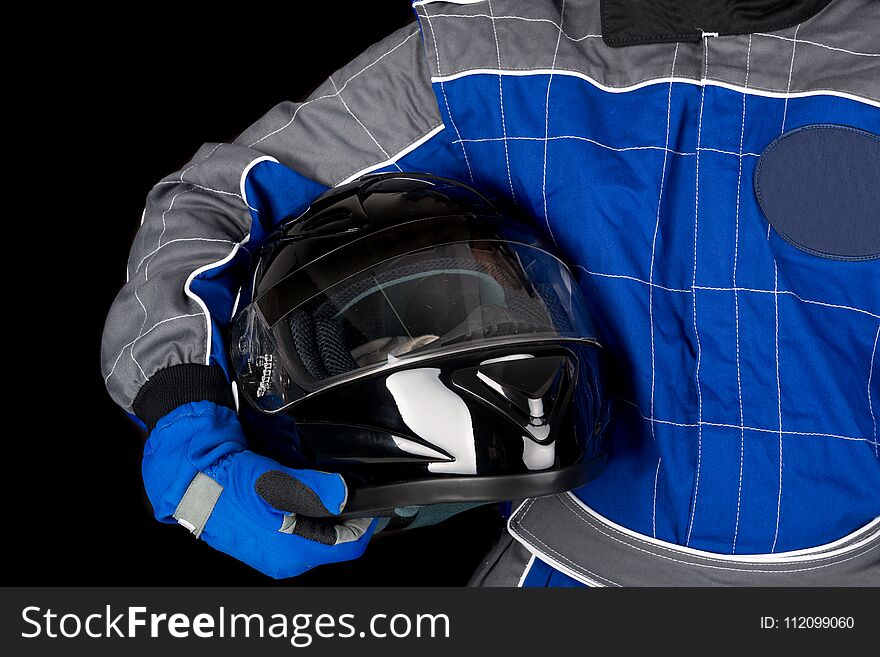 Racing driver body-part with helmet isolated in black. Racing driver body-part with helmet isolated in black