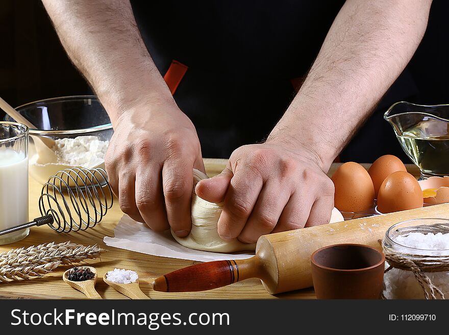 Baker knead dough bread, pizza or pie recipe ingredients with hands, food on kitchen table background, working with milk, yeast, f