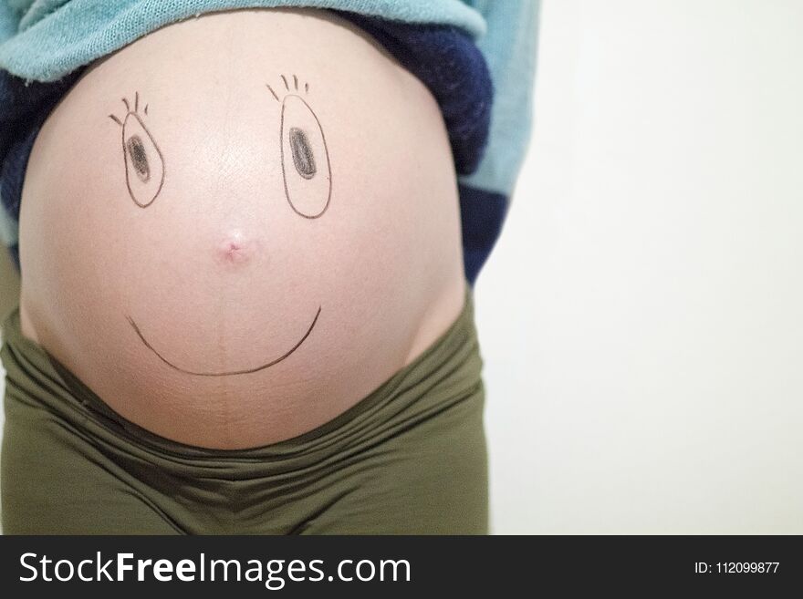 Funny faces on a belly