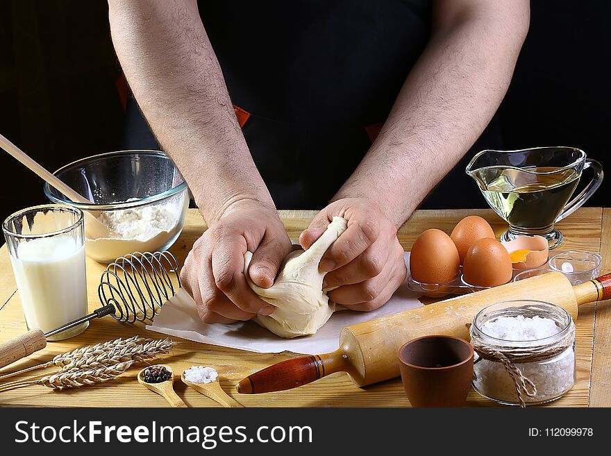 Baker knead dough bread, pizza or pie recipe ingredients with hands, food on kitchen table background, working with milk, yeast, f