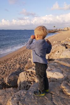 Boy Standing On Shore Wiping His Tears Royalty Free Stock Images