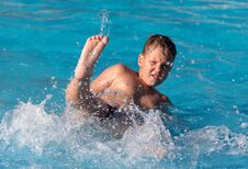 Boy Swims With A Splash In The Water Park Royalty Free Stock Photo Boy Swims With A Splash In The Water Park Royalty Free Stock Photo