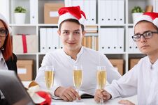 A Group Of Businesspeople Celebrating Christmas Stock Photo