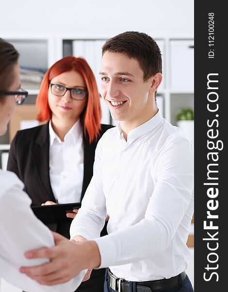 Smiling Man In Suit Shake Hands As Hello In Office