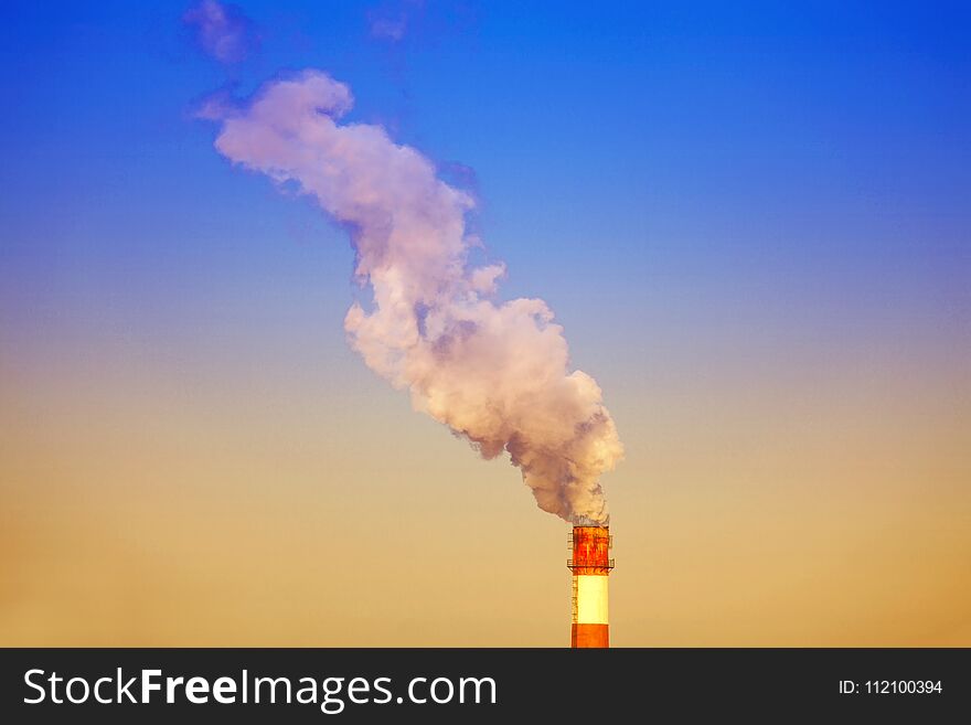 Dense smoke burst from the industrial pipes. Dense smoke burst from the industrial pipes