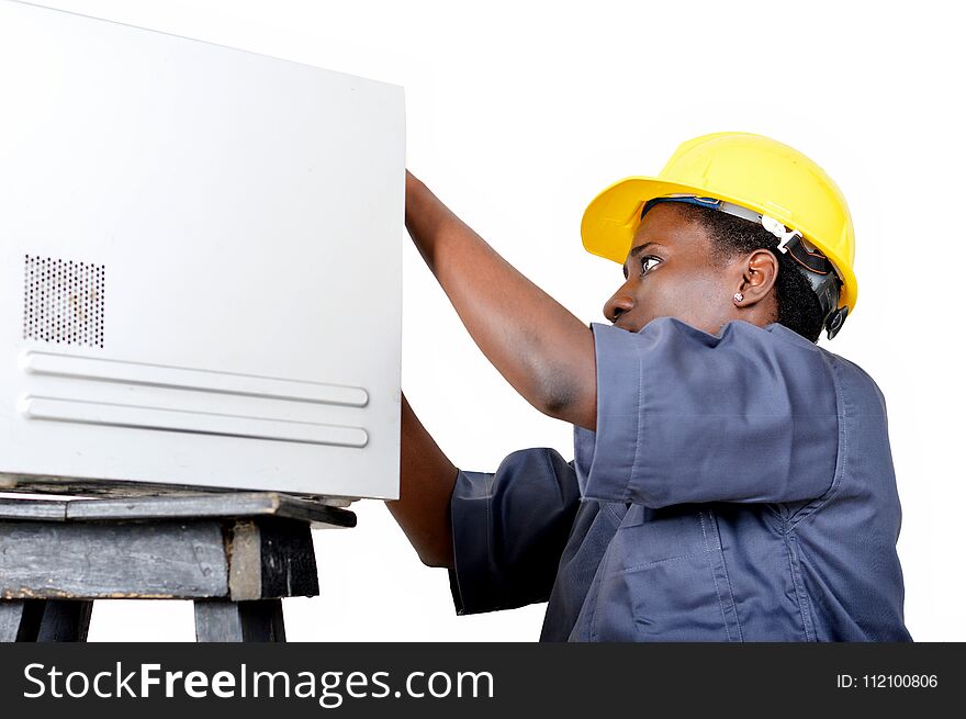 Close-up of a young woman doing the maintenance of a desktop computer. Close-up of a young woman doing the maintenance of a desktop computer.
