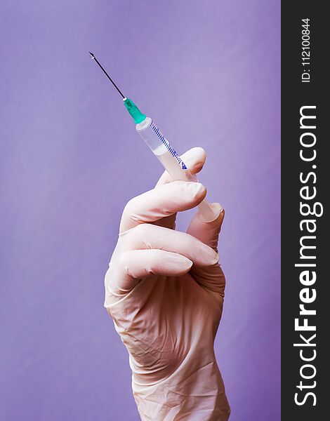 Doctor Holds In His Hand Syringe For Injection, Sterility In C