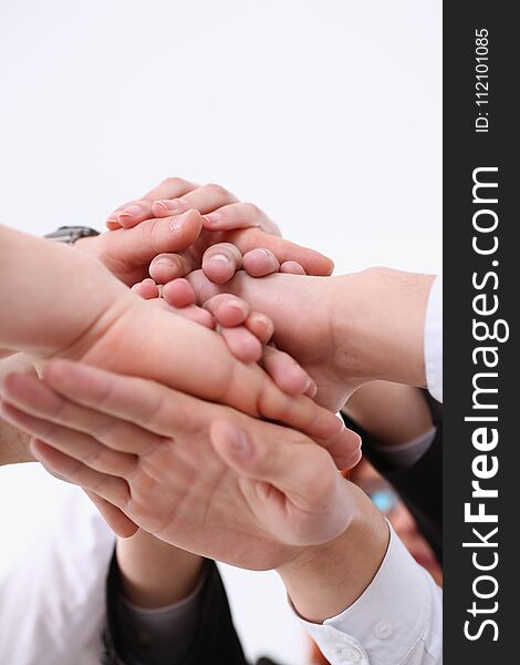 Group of people in suits crossed hands in pile for win closeup. White collar leadership high five cooperation initiative achievement, corporate life style friendship deal heap stack concept. Group of people in suits crossed hands in pile for win closeup. White collar leadership high five cooperation initiative achievement, corporate life style friendship deal heap stack concept