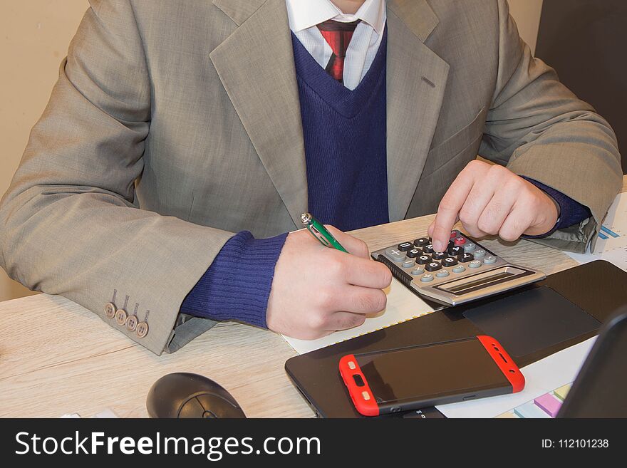 Administrator financial inspector and secretary making report, calculating or check balance. Hands of accountant with pen