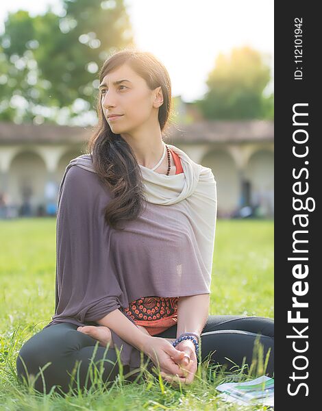 Student Girl Sitting In The School Lawn