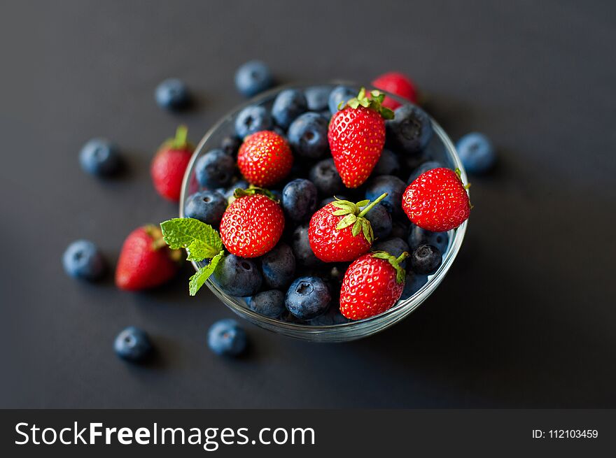 Mixed berries in a bowl : strawberries, raspberries, blueberries and blackberries. Mixed berries in a bowl : strawberries, raspberries, blueberries and blackberries