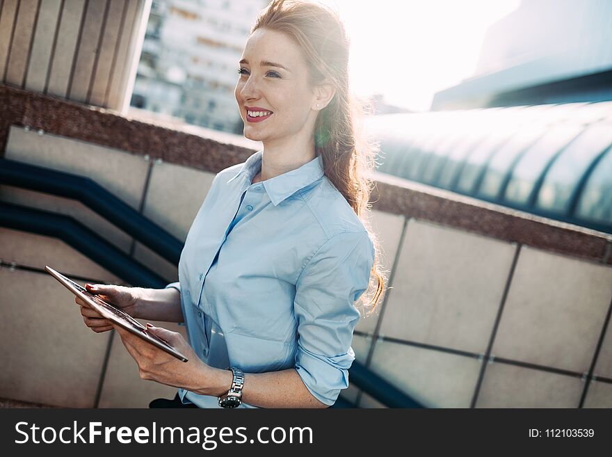 Portrait of business woman smiling outdoor