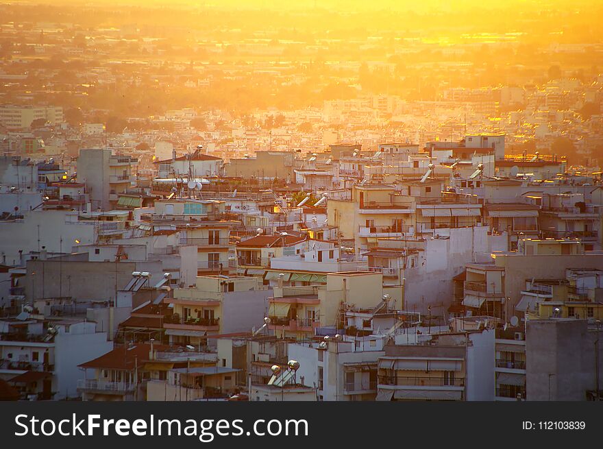 Sunset over a densely populated residential district in western Thessalonica - Greece