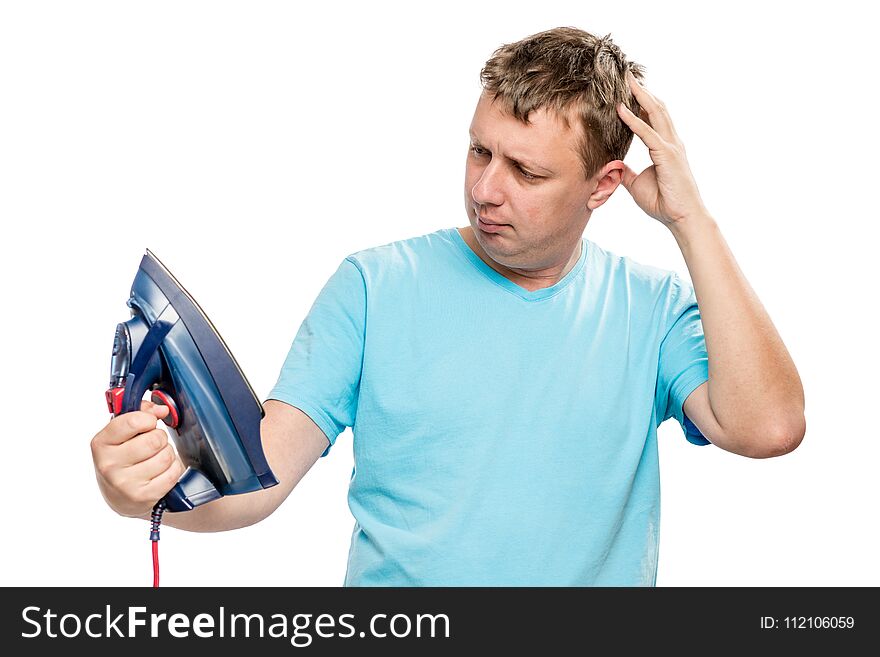 Pensive man looking at iron, portrait on white background is islated