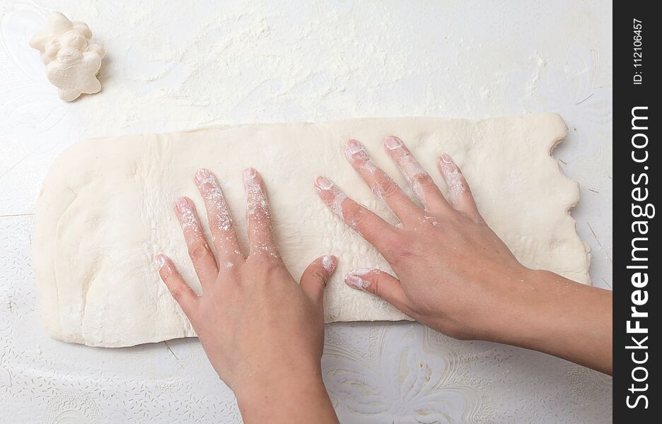 Rolling the dough in the kitchen . Photos in the studio