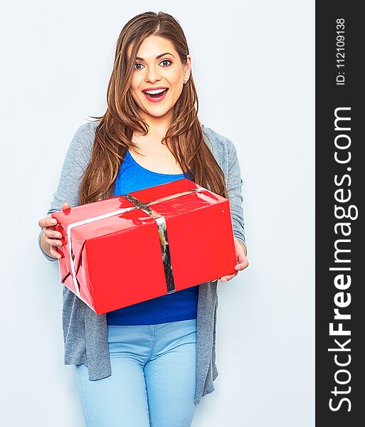 Surprising Woman hold big gift box. Big smile with teeth. Emotion of happy woman. White wall background. Red gift box.