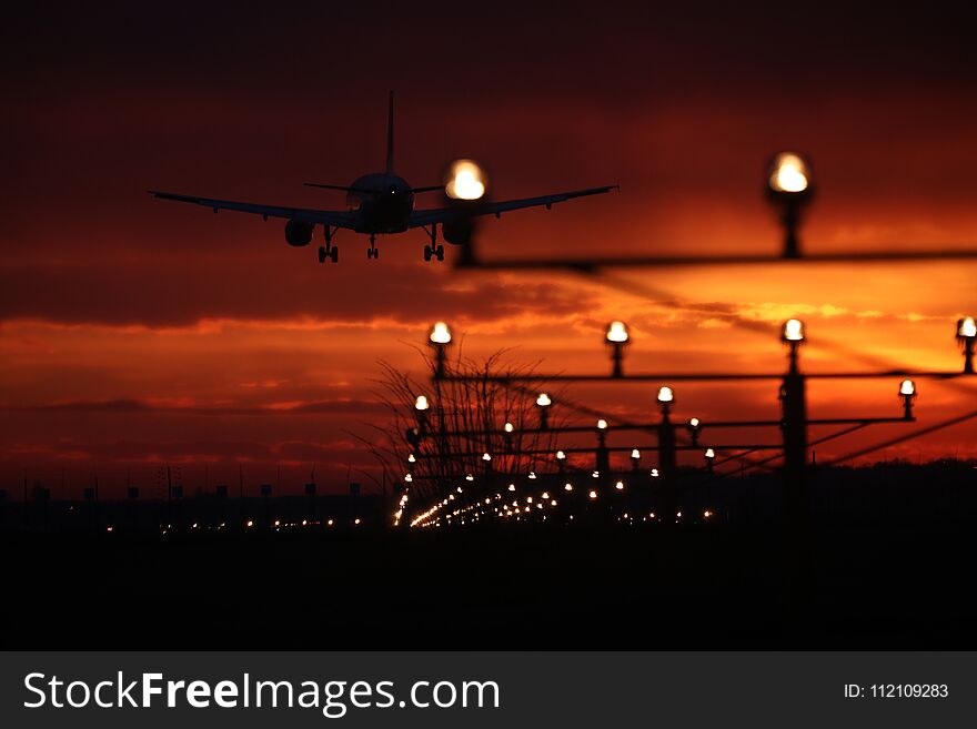 Silhouette Of Plane Flying Up In The Blue Sky, Landing