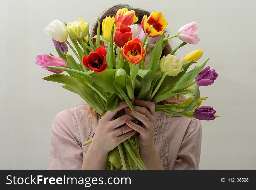 Young Charming Girl With A Bouquet Of Flowers - Multi-colored Tulips