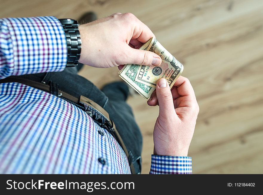 Person Holding 100 Us Dollar Banknote