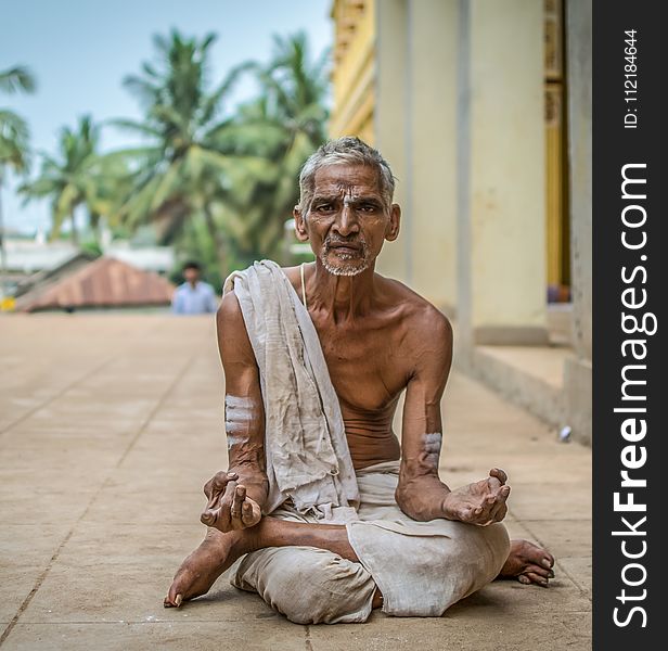 Man Meditating at Daytime