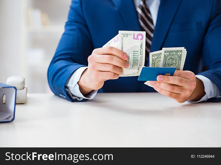 The Businessman Holding Dollar Money And Credit Card