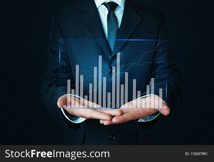 Businessman holding graph. Finance concept.