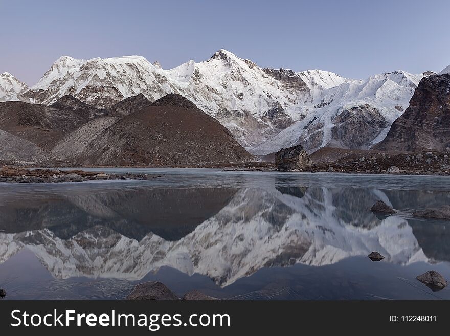 Beautiful mountain Cho Oyu reflecting in the gray.