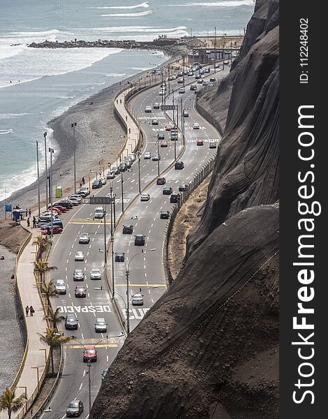 A road with 6 lanes runs along the beaches of Lima Peru. A road with 6 lanes runs along the beaches of Lima Peru.