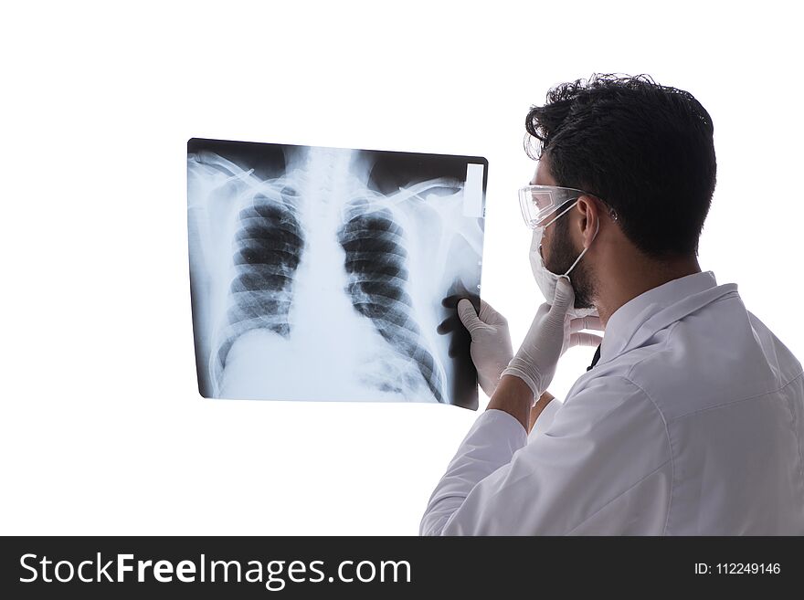 The Young Doctor Looking At X-ray Images Isolated On White