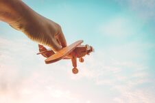 Toy Airplane In Hand Royalty Free Stock Images
